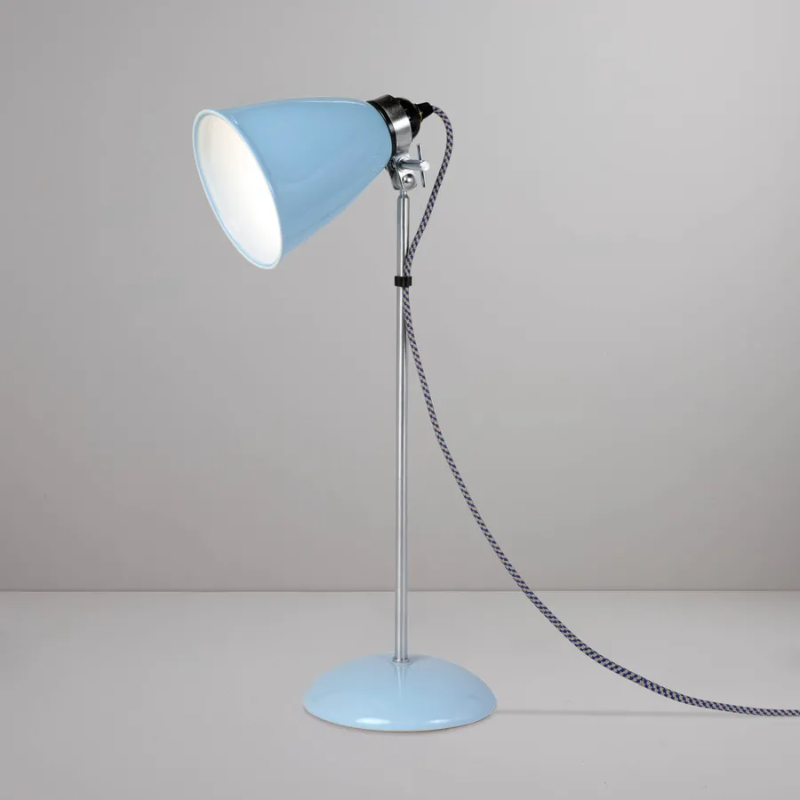 A British design classic in translucent Bone China. With its moveable shade and smart cotton braided cable, the Hector Table Light perfectly combines style and function. Available in three colors (natural white, light blue or light green) with varying sized shades.