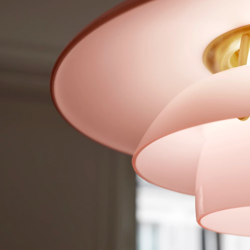 Inspired by Poul Henningsen’s fascination with the interplay between color and light, and the interior trends of today, the PH 3½-3 Pale Rose Brass Pendant features mouthblown pale rose-colored glass shades, which create a whimsical and poetic atmosphere in every room. The elegant expression is enhanced by the brushed brass detailing which, if left untreated, will patinate beautifully over time, giving the lamp character and charm.
