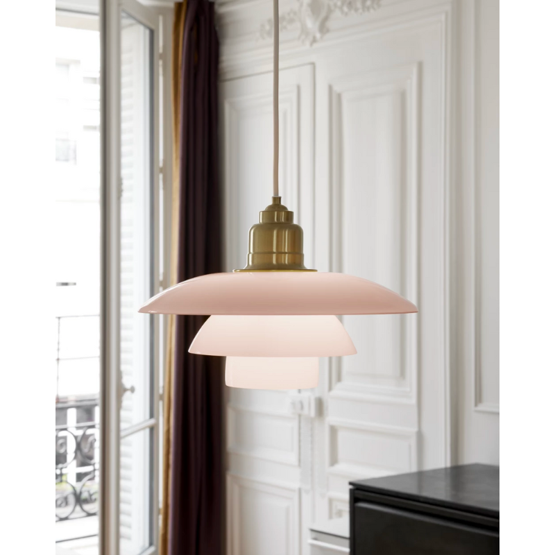 Inspired by Poul Henningsen’s fascination with the interplay between color and light, and the interior trends of today, the PH 3½-3 Pale Rose Brass Pendant features mouthblown pale rose-colored glass shades, which create a whimsical and poetic atmosphere in every room. The elegant expression is enhanced by the brushed brass detailing which, if left untreated, will patinate beautifully over time, giving the lamp character and charm.