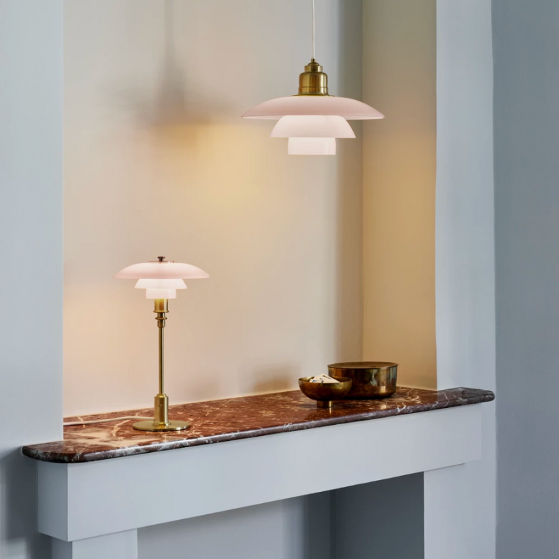 Inspired by Poul Henningsen’s fascination with the interplay between color and light, and the interior trends of today, the PH 3½-3 Pale Rose Brass Pendant features mouthblown pale rose-colored glass shades, which create a whimsical and poetic atmosphere in every room. The elegant expression is enhanced by the brushed brass detailing which, if left untreated, will patinate beautifully over time, giving the lamp character and charm.