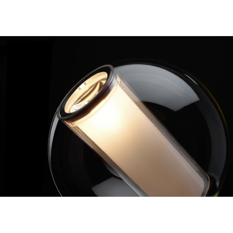 The Bel Occhio Table light from Pablo Designs in white, lit up in a lifestyle shot.