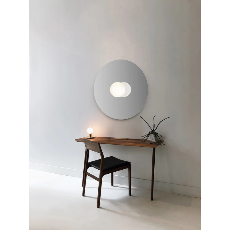 The Bola Disc Flush from Pablo Designs above an office desk.