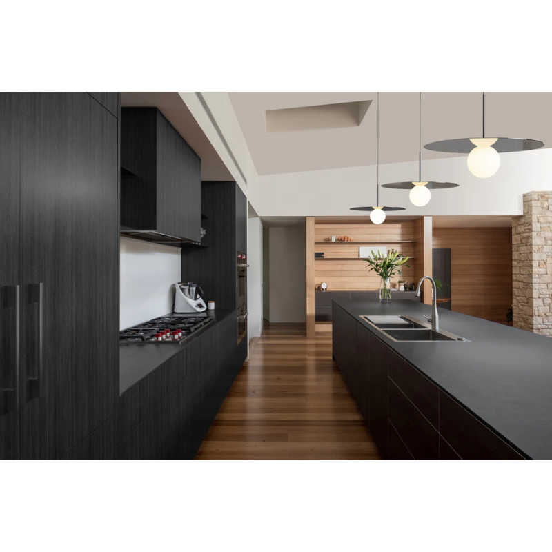 The Bola Disc Pendant featured in a kitchen.