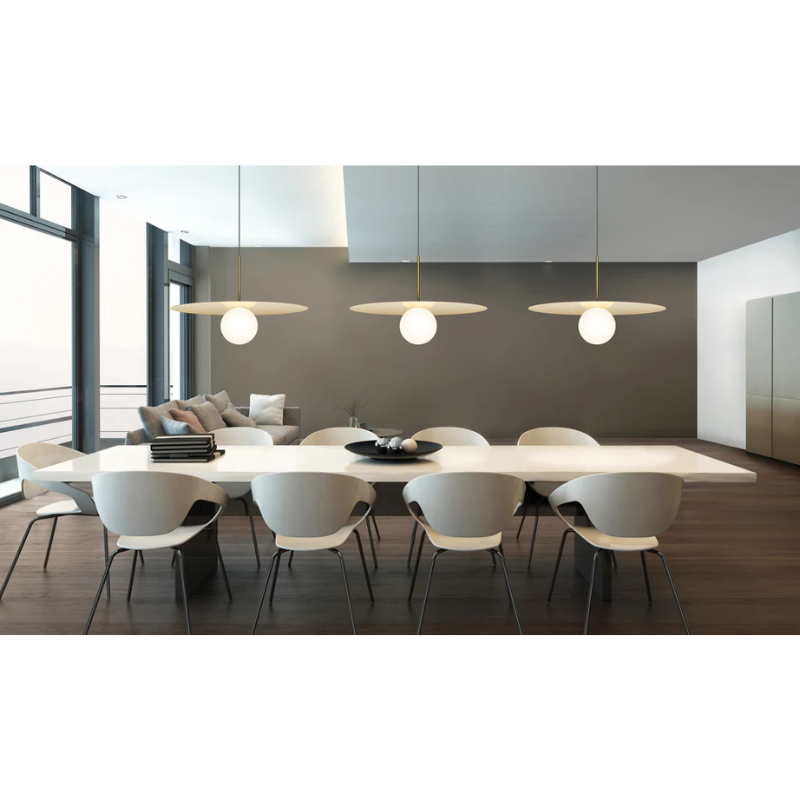 The Bola Disc Pendant in a dining setting.
