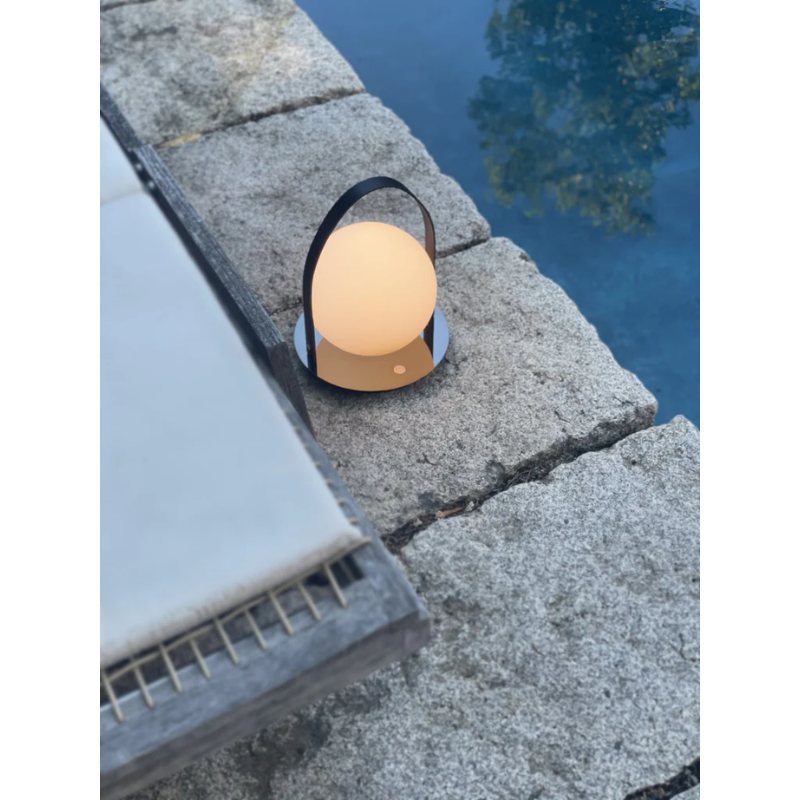 The Bola Lantern next to a pool.