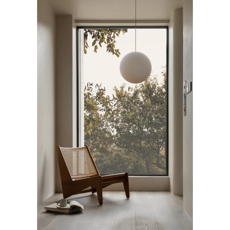 The Bola Sphere from Pablo Designs in a lounge area.