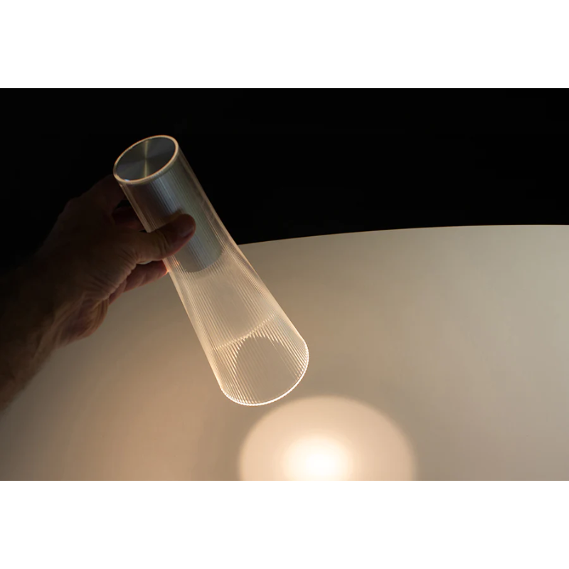 Inspired by a cone of light, Candél’s graceful vessel-like silhouette is in perfect harmony with its surroundings allowing the environment to filter through. Candél casts a warm, intimate candle-like glow that’s sure to seduce and become the central focus of any social gathering.