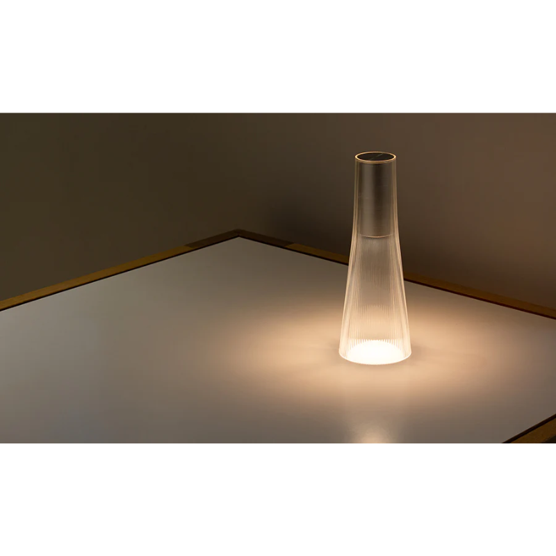 Inspired by a cone of light, Candél’s graceful vessel-like silhouette is in perfect harmony with its surroundings allowing the environment to filter through. Candél casts a warm, intimate candle-like glow that’s sure to seduce and become the central focus of any social gathering.