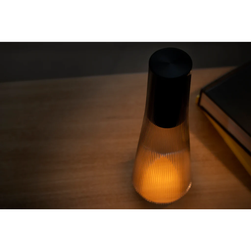 Inspired by a cone of light, Candél’s graceful vessel-like silhouette is in perfect harmony with its surroundings allowing the environment to filter through. Candél casts a warm, intimate candle-like glow that’s sure to seduce and become the central focus of any social gathering.