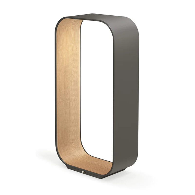 The large version of the Contour Table light from Pablo Designs in graphite and white oak.