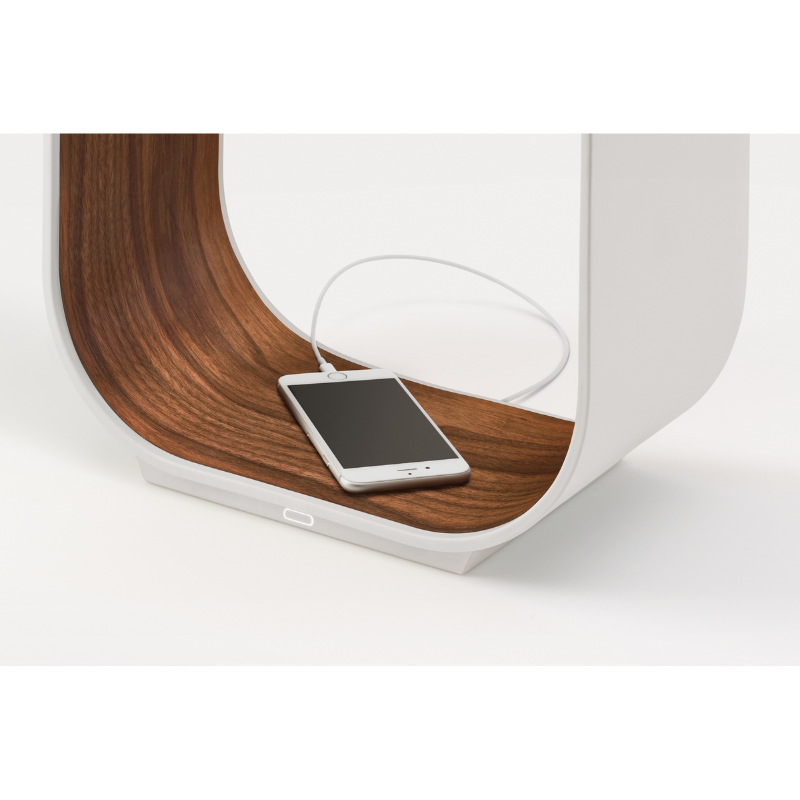 The Contour Table from Pablo Designs charging a phone from the built in USB port.