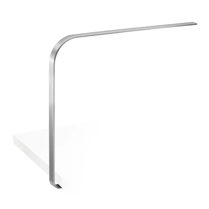 The LIM C under-surface table light from Pablo Designs in brushed aluminum.