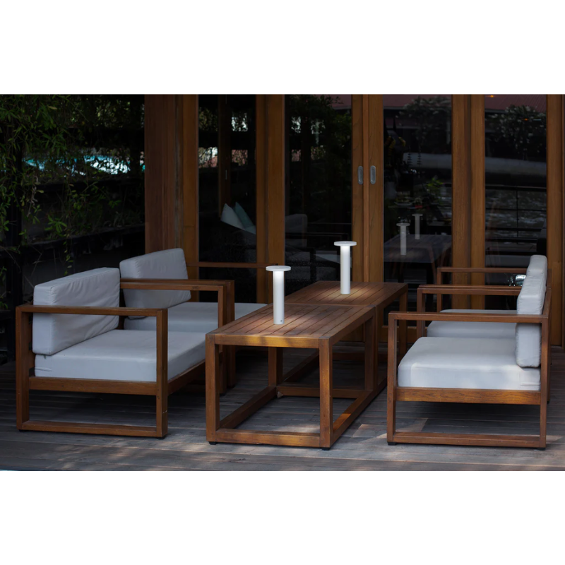 The Luci Table from Pablo Designs outdoors in a living space.