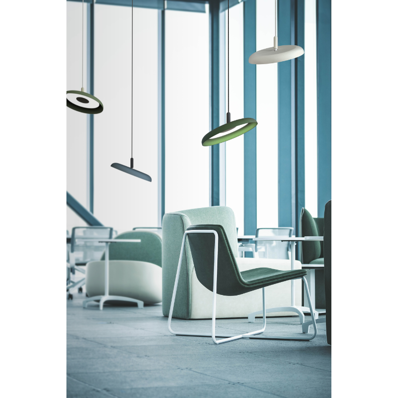 Four of the Nivél Pendants from Pablo Designs found within an office space for meeting and socializing with others.