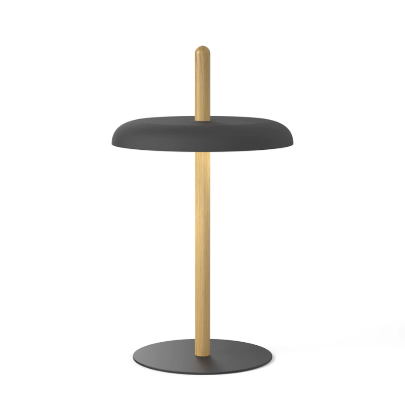 The Nivél Table from Pablo Designs with an oak post and black shade.