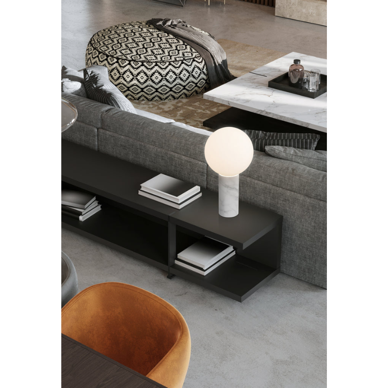 The Pilar from Pablo Designs on top of a low table within a family space behind a couch.