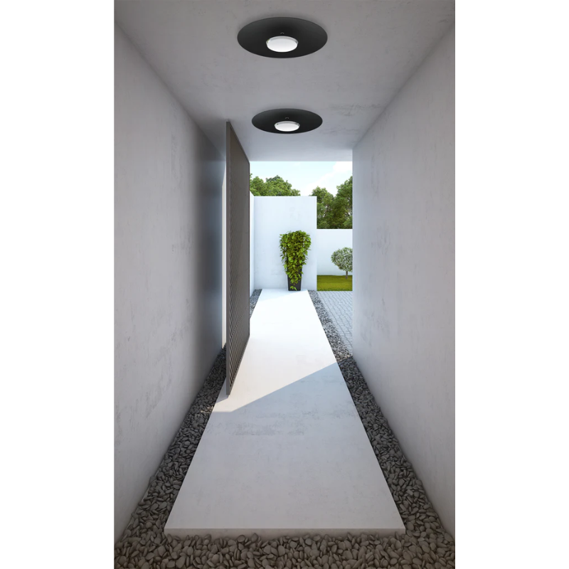 The Sky Dome Flush Metal from Pablo Designs lining a hallway in a courtyard.