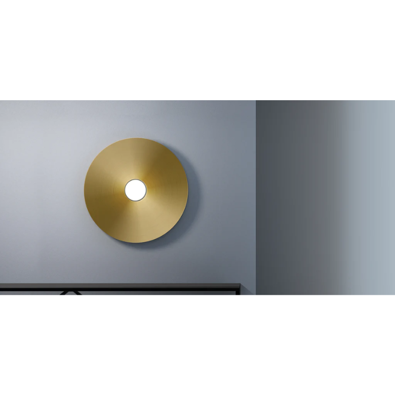 The Sky Dome Flush Metal from Pablo Designs with the brass dome mounted into a wall.