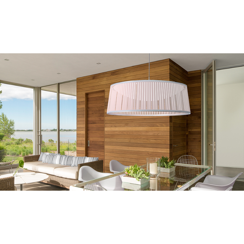 The Solis Drum from Pablo Designs in a living room above a table.