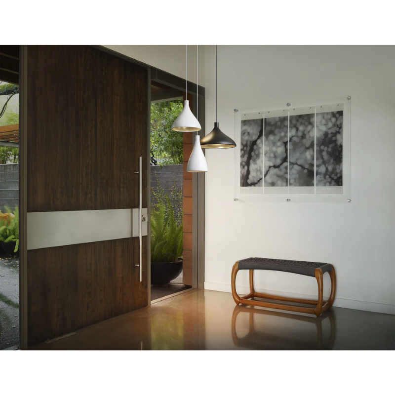 The Swell Single pendant from Pablo Designs in the entryway to a home.