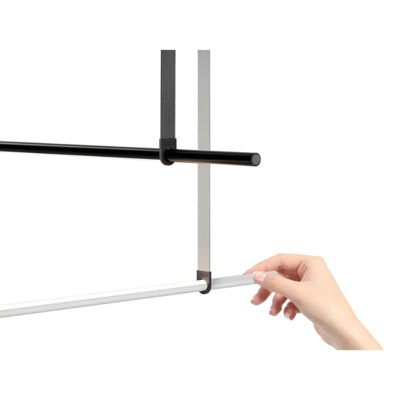 The T.O Pendant Suspension Belt Accessory from Pablo Designs in a liefstyle shot showing the graphite and light grey color options.