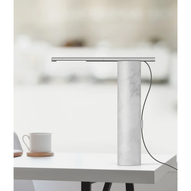 The T.O Table from Pablo Designs in a dining room on the dining table.