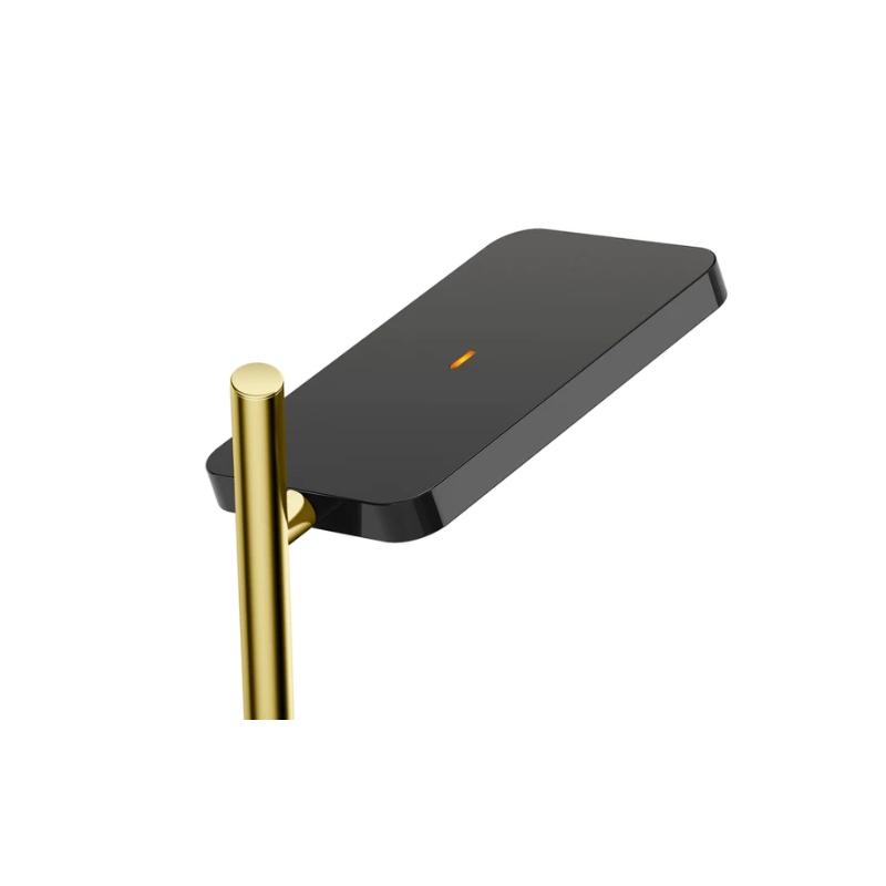 The Talia Table from Pablo Designs in black and brass, in a detailed close up shot showing the head of the light and the brass stem.