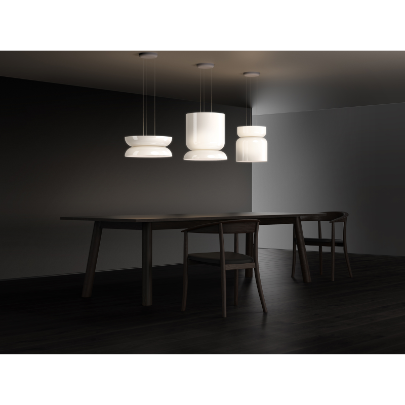 The Totem Up/Down Light from Pablo Designs in a dining room above the dining room table.