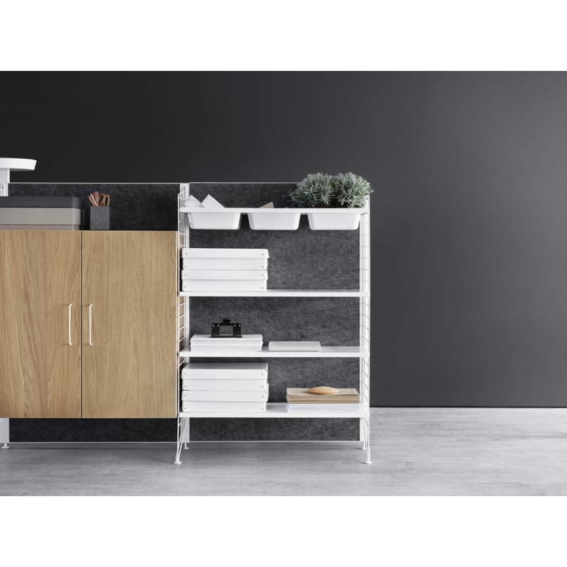 The Bowl Shelf from String Furniture in a living room.