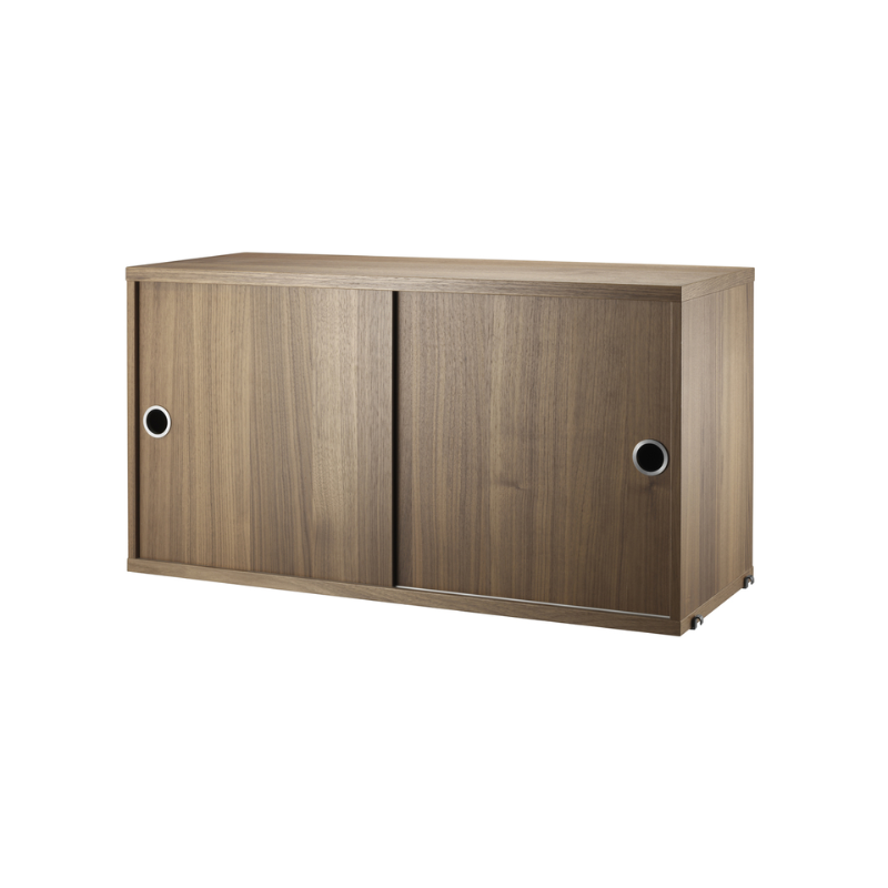 The Cabinet with Sliding Doors from String Furniture in the 11.8 inch depth size and walnut color.