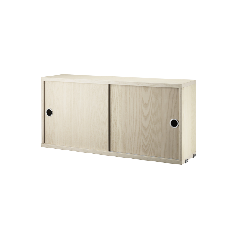 The Cabinet with Sliding Doors from String Furniture in the 7.8 inch depth size and ash color.