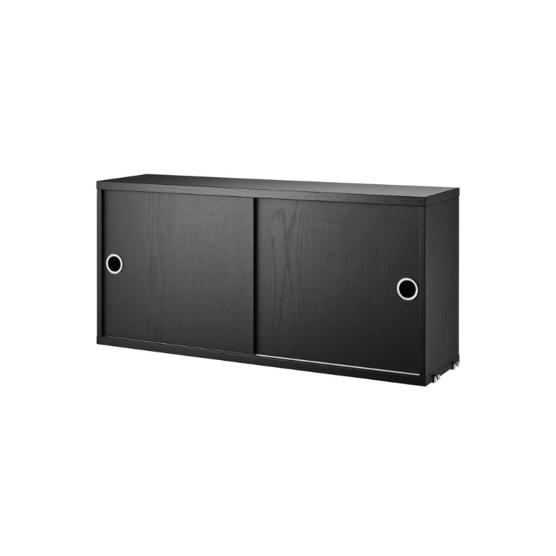 The Cabinet with Sliding Doors from String Furniture in the 7.8 inch depth size and black stained ash color.