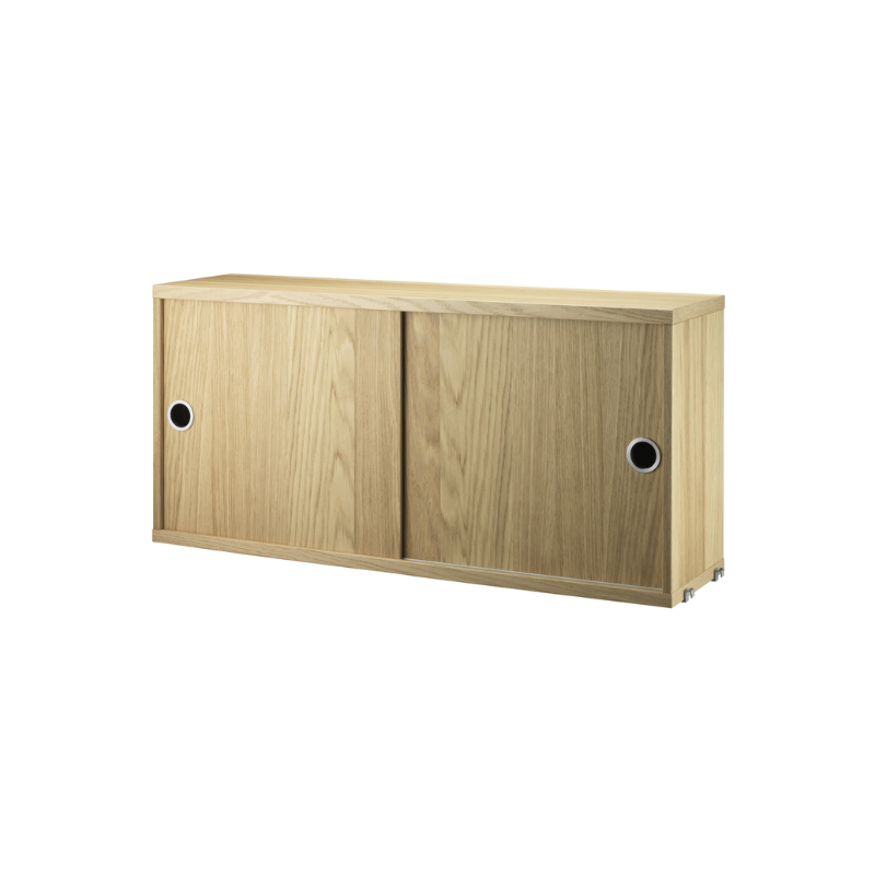 The Cabinet with Sliding Doors from String Furniture in the 7.8 inch depth size and oak color.