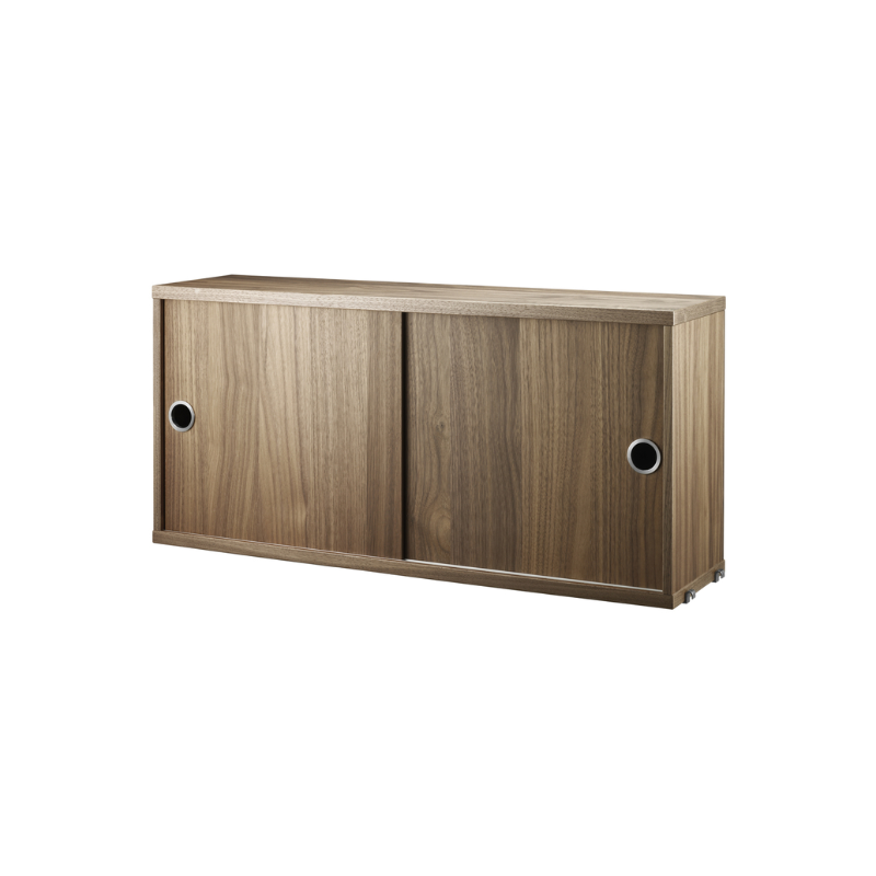 The Cabinet with Sliding Doors from String Furniture in the 7.8 inch depth size and walnut color.