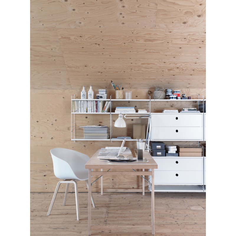 The Chest of Drawers from String Furniture in a family space.