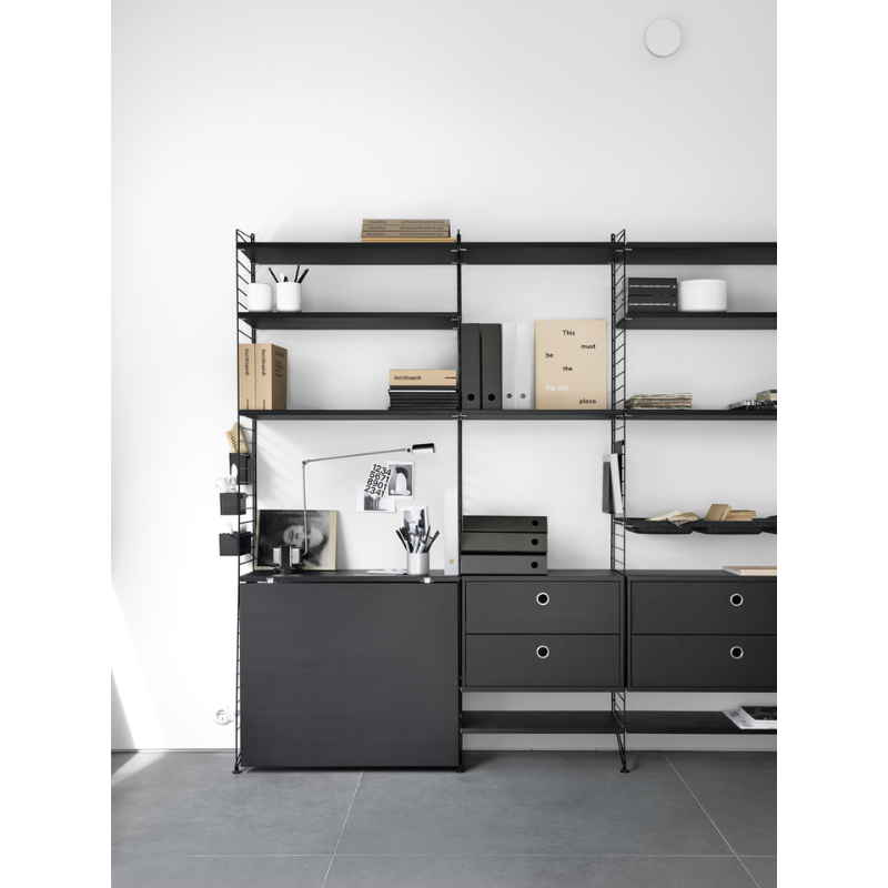 The Chest of Drawers from String Furniture in a living room.