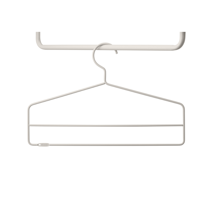 The Coat Hangers from String Furniture in beige.