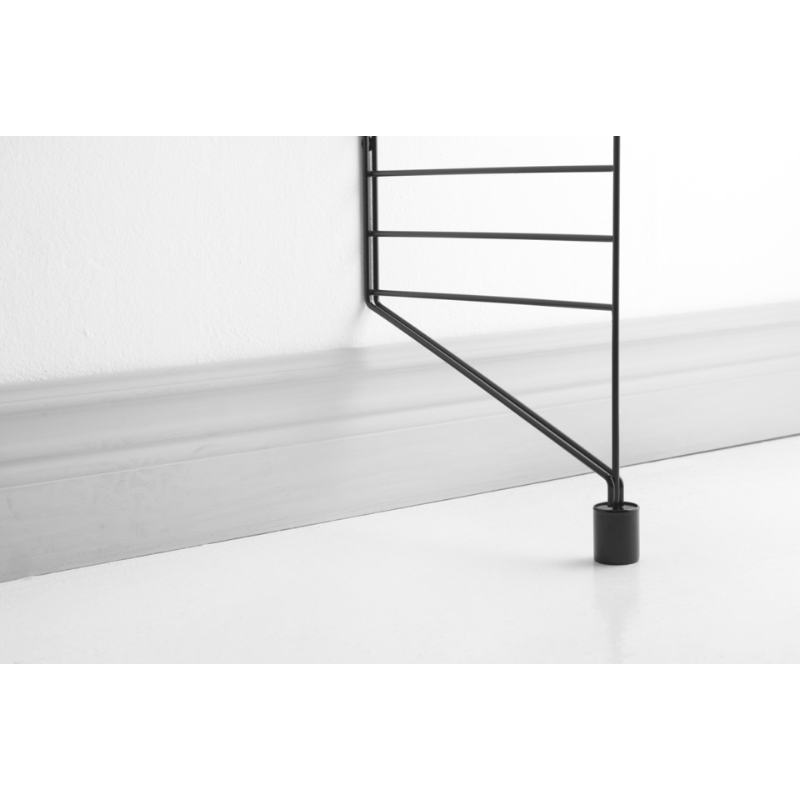 The Floor Panel Extension from String Furniture in a lounge lifestyle photograph.