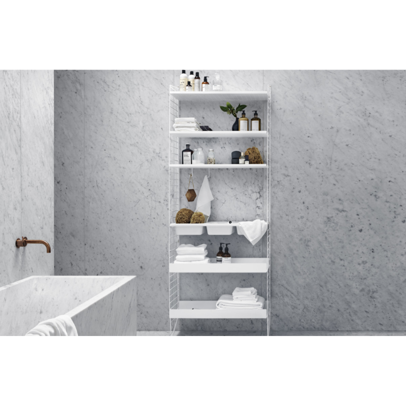 The Floor Panels from String Furniture in white in a bathroom.