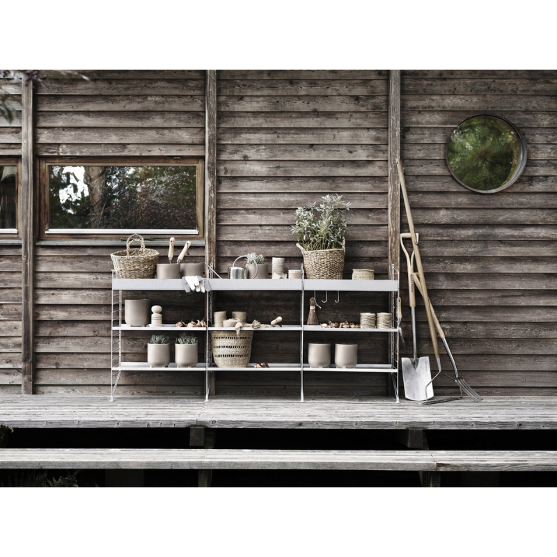 The J Hook from String Furniture in an outdoor garden shot.