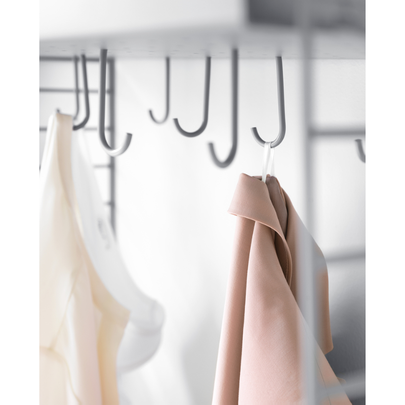 The J Hook from String Furniture in a wardrobe.