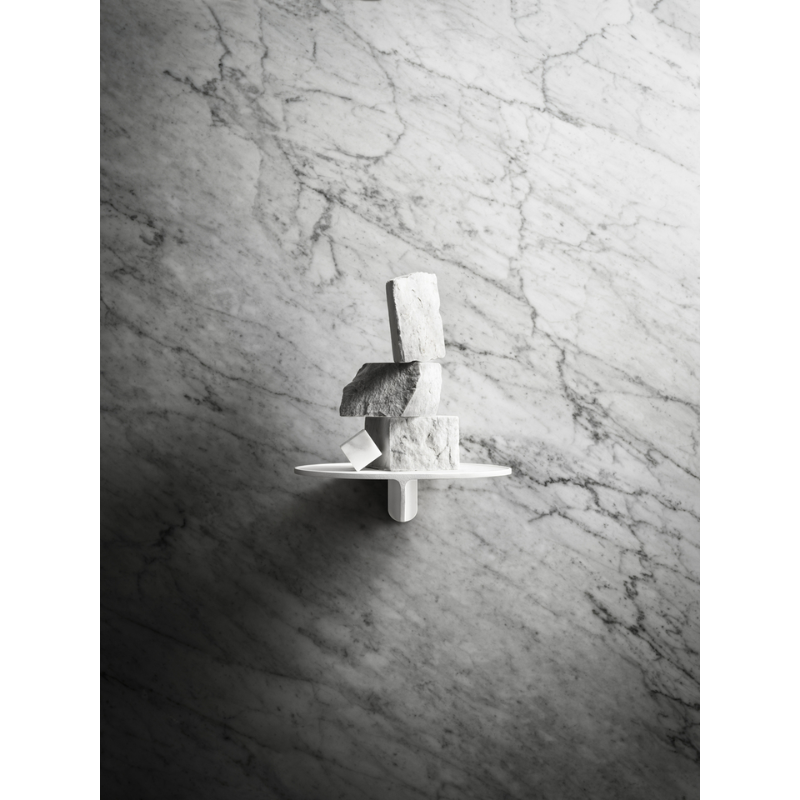 The Museum NM&.045 Console Shelf from String Furniture holding artwork.