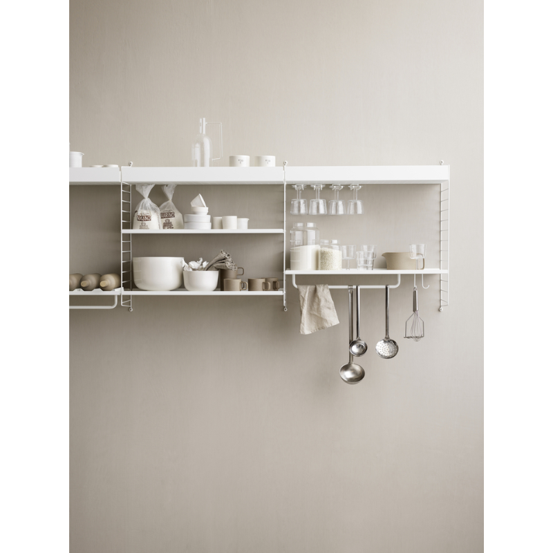 The Rods from String Furniture in a dining room.