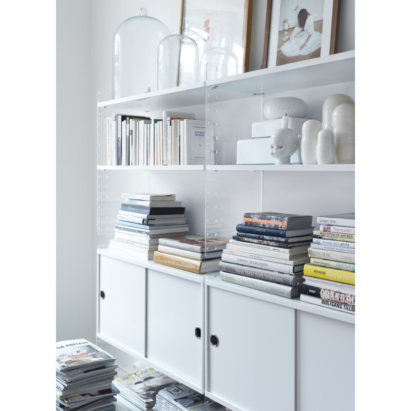 The Shelves from String Furniture holding accessories.