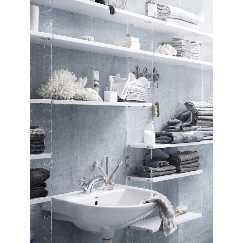 The Shelves from String Furniture in a bathroom surrounding a sink.