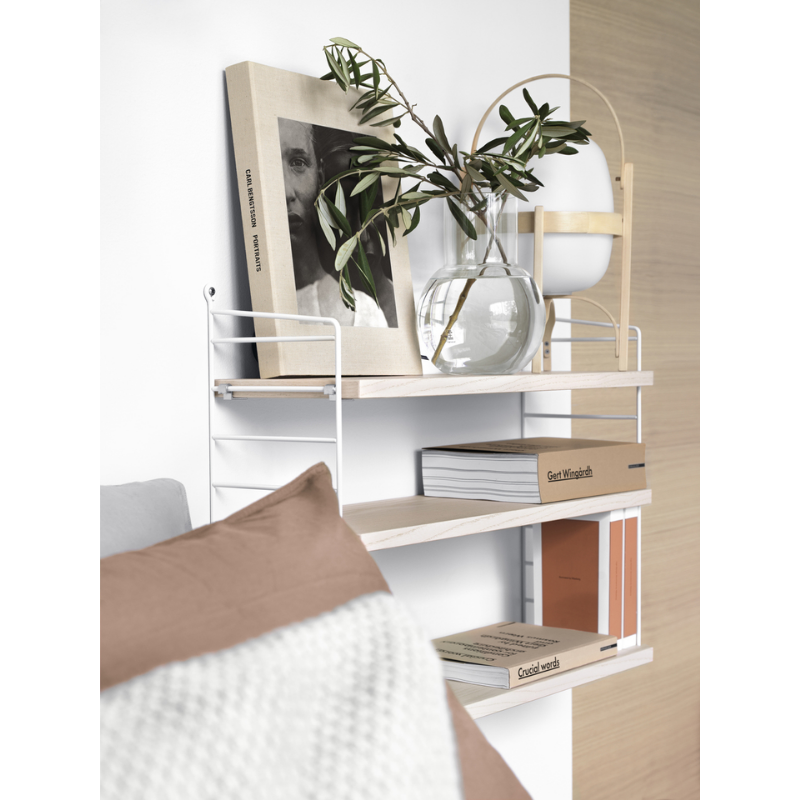 The Shelves from String Furniture in a bedroom.