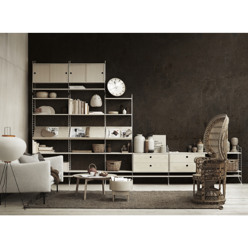 The Shelves from String Furniture in a den.