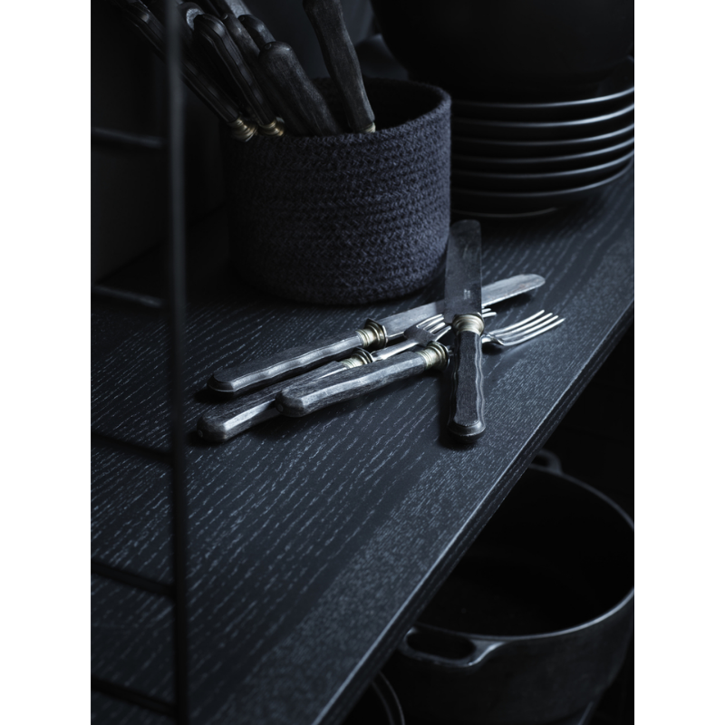 The Shelves from String Furniture in a dining room.