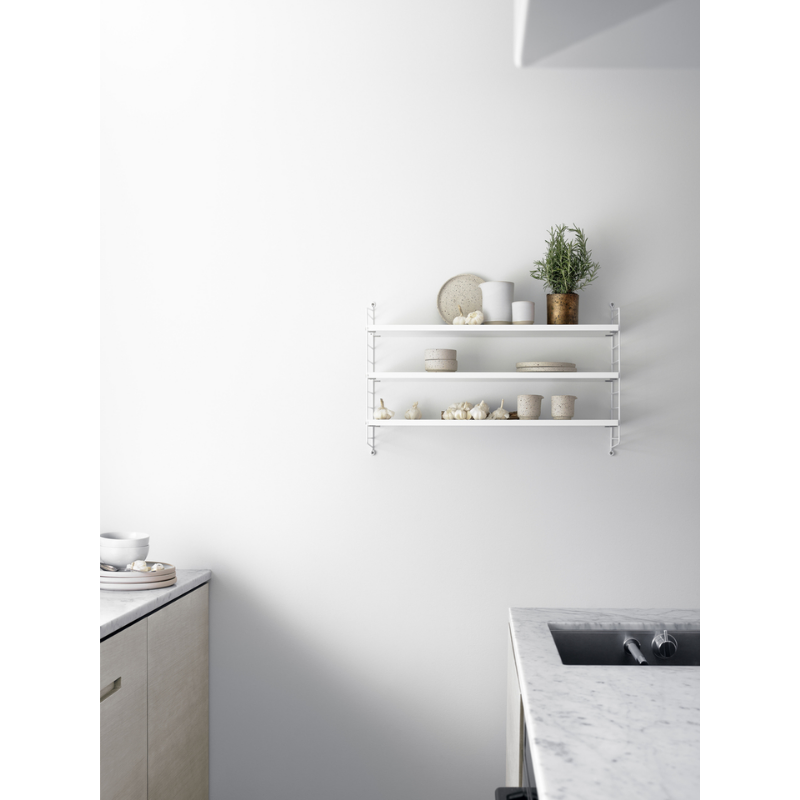 The Shelves from String Furniture in a ktichen.