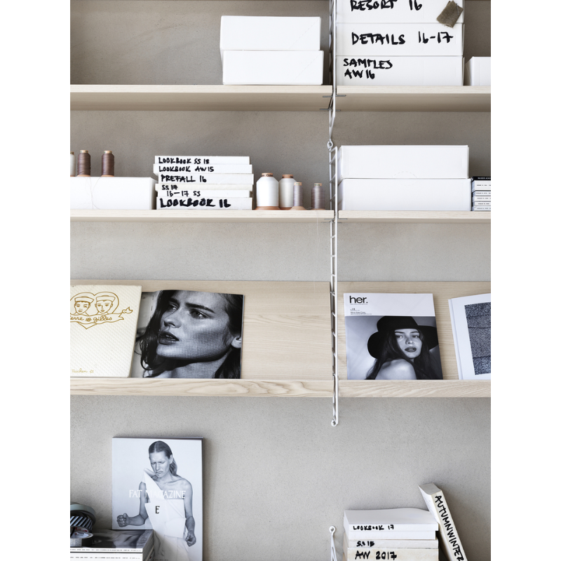 The Shelves from String Furniture used for music, books and other art.